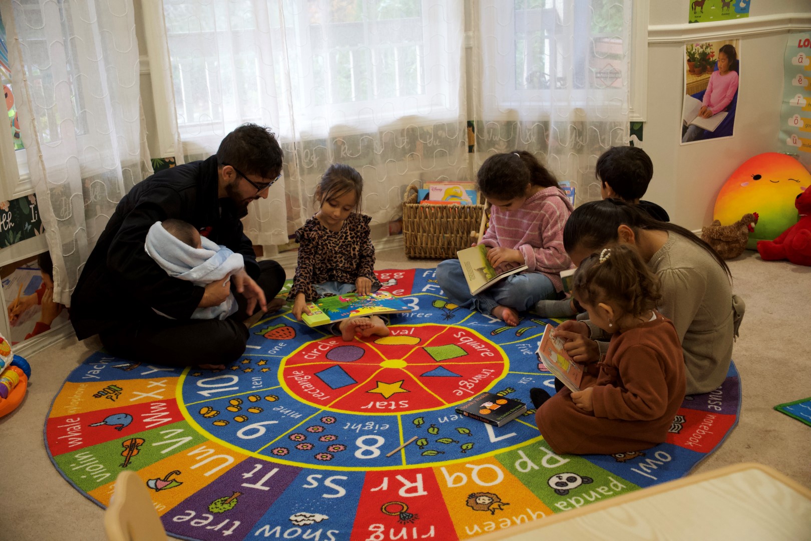 children sitting in a circle with adult